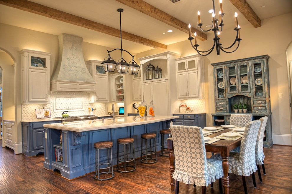 Inspiration for a large timeless medium tone wood floor kitchen remodel in Dallas with an undermount sink, blue cabinets, marble countertops, white backsplash, ceramic backsplash, paneled appliances and an island