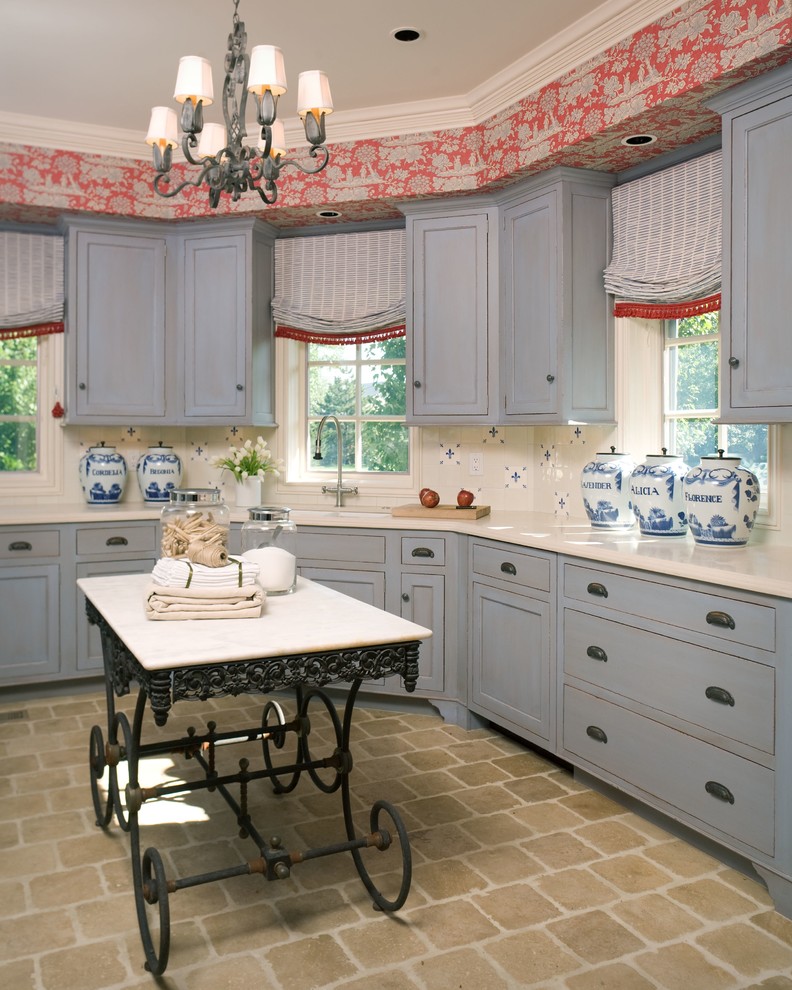 Inspiration for a mediterranean kitchen remodel in Wichita with blue cabinets