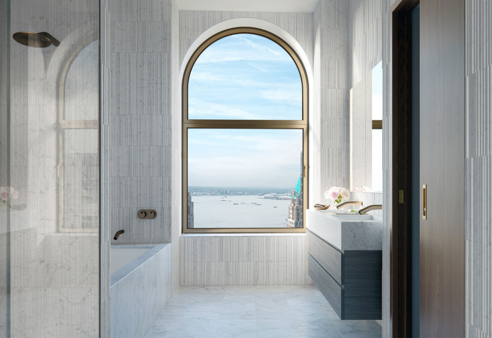 Idee per un'ampia stanza da bagno moderna con ante lisce, ante nere e parquet chiaro