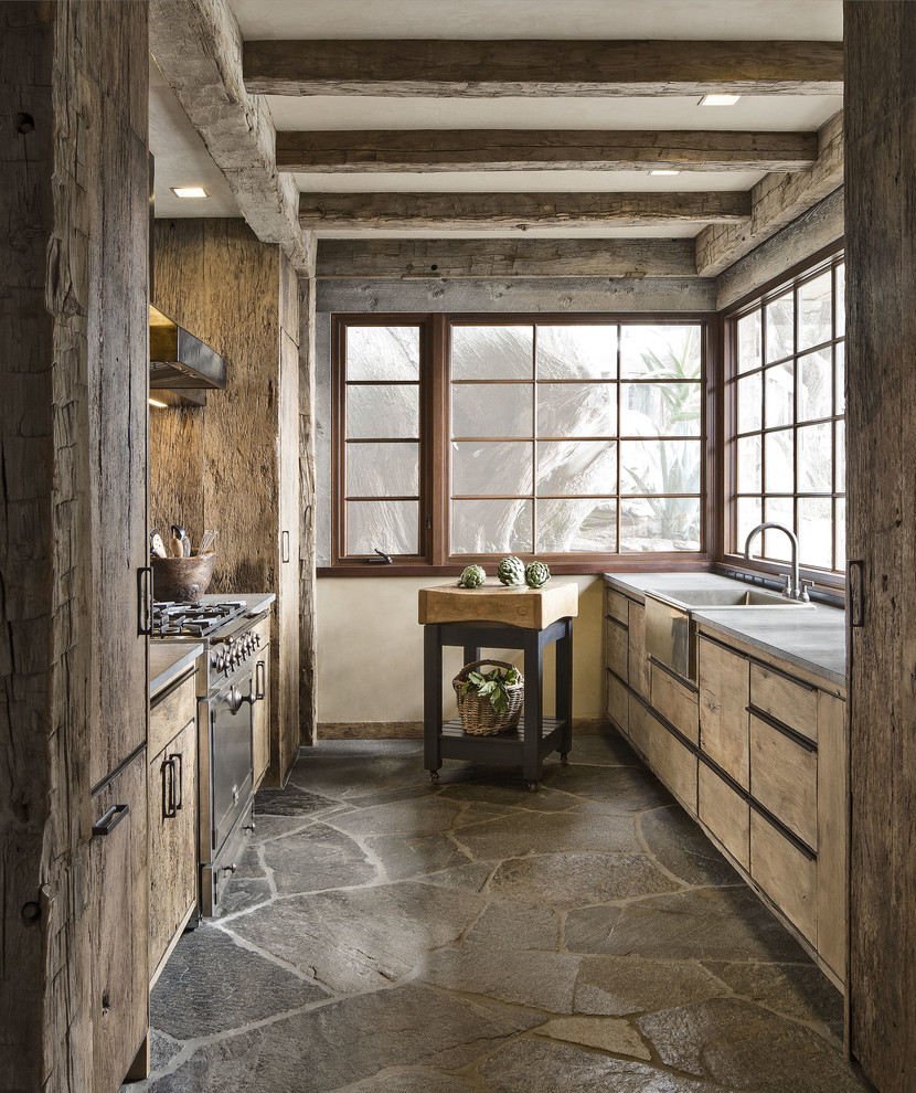 Photo of a rustic galley kitchen in San Francisco with a belfast sink, flat-panel cabinets, medium wood cabinets and no island.