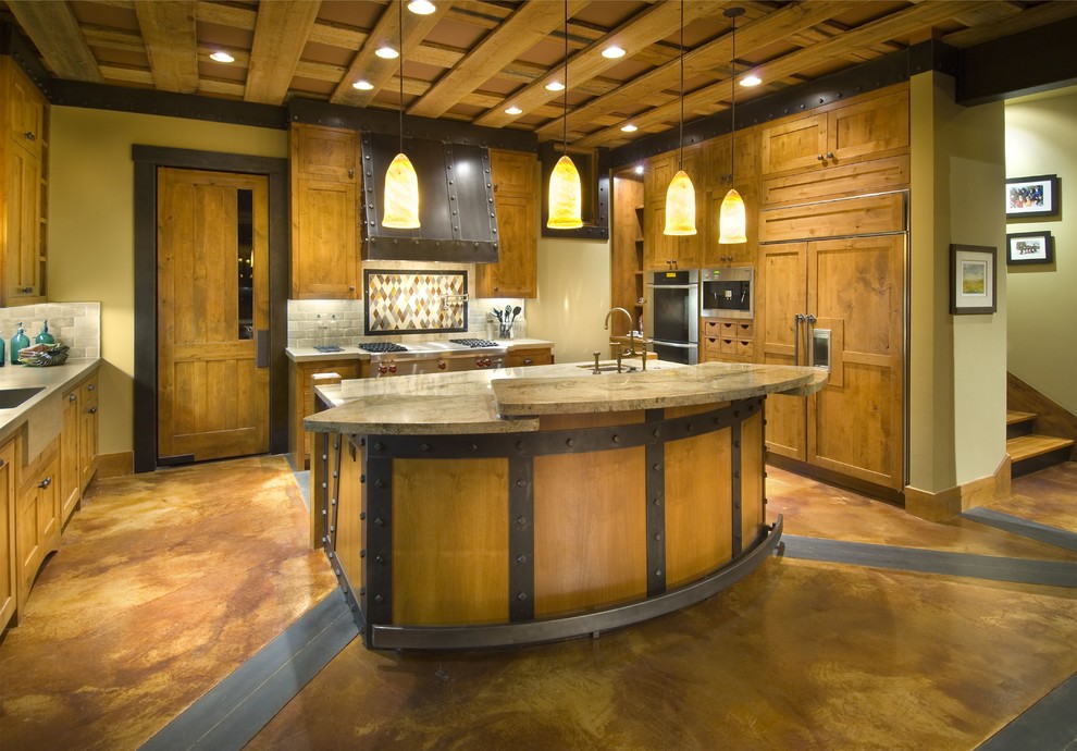 Immagine di una cucina ad U rustica con ante in stile shaker, ante in legno scuro, top in granito, paraspruzzi multicolore e elettrodomestici da incasso