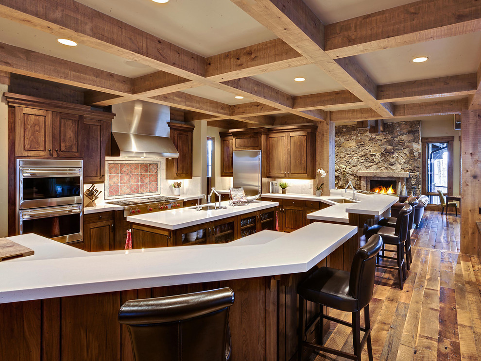 Rustikale Küche mit Küchengeräten aus Edelstahl und Mauersteinen in Salt Lake City