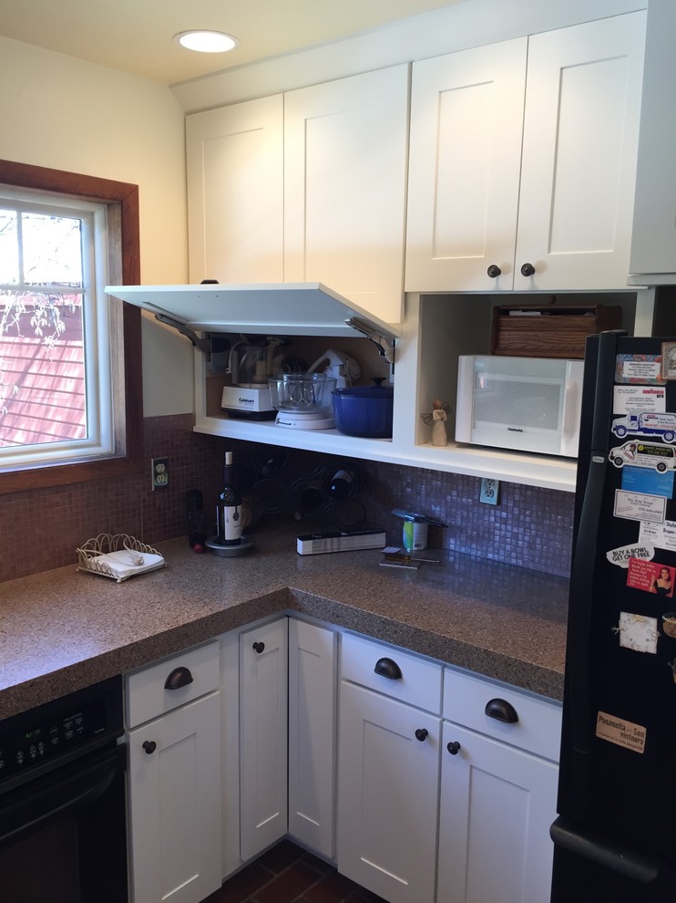 Medium sized traditional u-shaped kitchen/diner in Denver with a submerged sink, shaker cabinets, white cabinets, engineered stone countertops, brown splashback, ceramic splashback, black appliances, terracotta flooring and a breakfast bar.