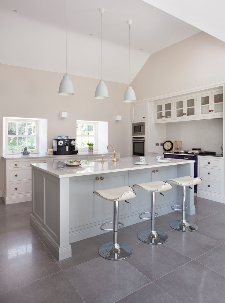 Inspiration for a large rural u-shaped kitchen/diner in Other with an integrated sink, beaded cabinets, white cabinets, quartz worktops, grey splashback, marble splashback, coloured appliances, porcelain flooring, an island and grey floors.