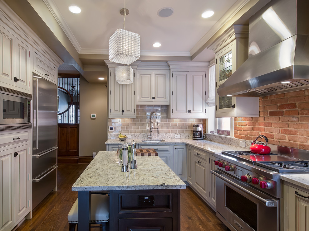 Inspiration for a mid-sized timeless u-shaped dark wood floor enclosed kitchen remodel in Denver with an undermount sink, raised-panel cabinets, white cabinets, granite countertops, gray backsplash, stainless steel appliances, an island and subway tile backsplash