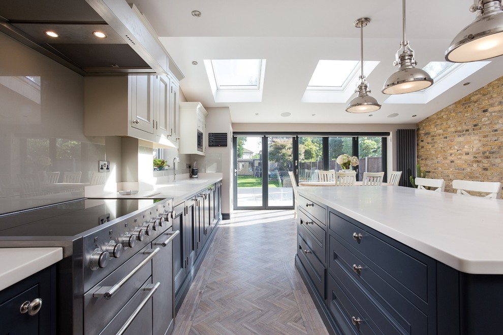 Inspiration for a large victorian l-shaped open concept kitchen remodel in London with shaker cabinets, gray cabinets and an island