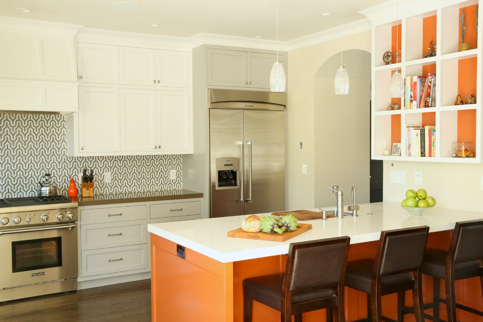 Trendy galley kitchen photo in San Francisco with recessed-panel cabinets, white cabinets and stainless steel appliances
