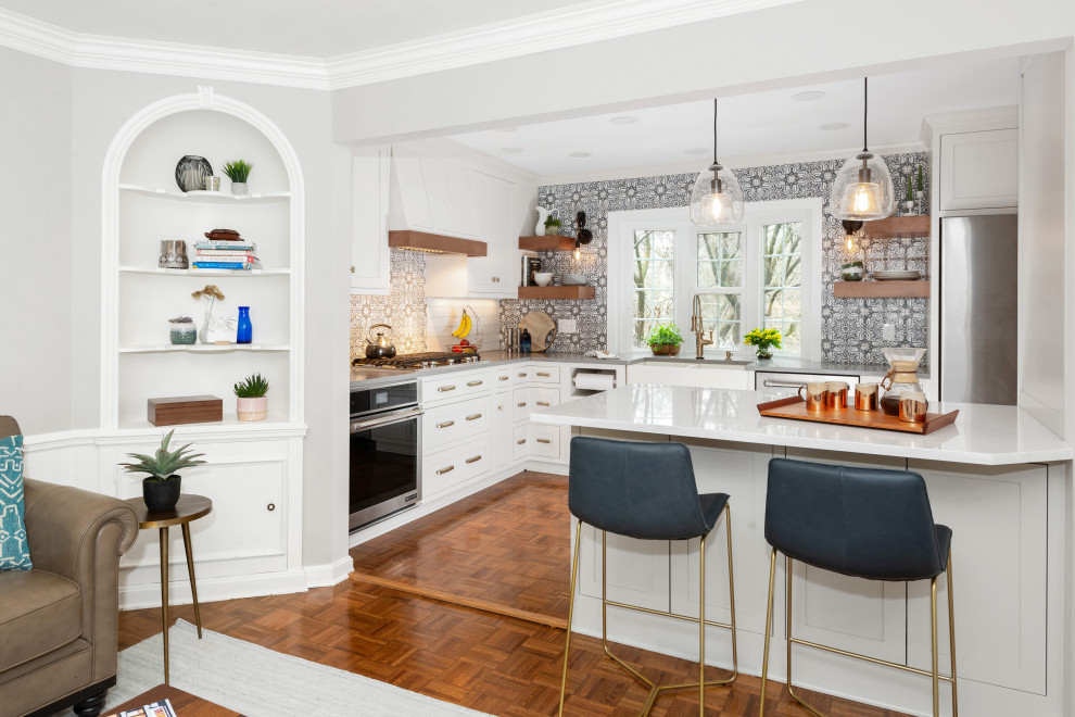 Inspiration for a small eclectic l-shaped medium tone wood floor and brown floor kitchen pantry remodel in Other with a farmhouse sink, beaded inset cabinets, white cabinets, quartz countertops, blue backsplash, terra-cotta backsplash, stainless steel appliances, a peninsula and gray countertops