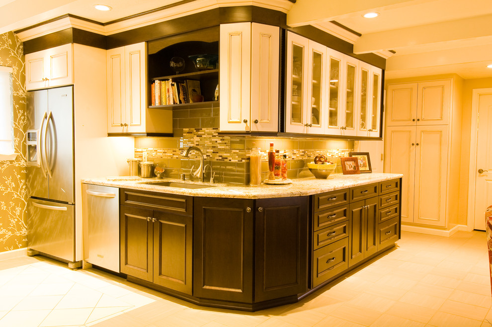 Example of a mid-sized classic l-shaped eat-in kitchen design in Other with recessed-panel cabinets and wood countertops