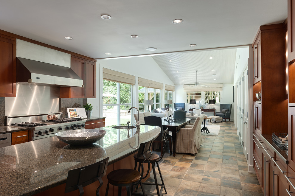 Example of a large trendy galley ceramic tile and brown floor open concept kitchen design in Atlanta with a triple-bowl sink, shaker cabinets, medium tone wood cabinets, granite countertops, brown backsplash, stone slab backsplash, stainless steel appliances and an island