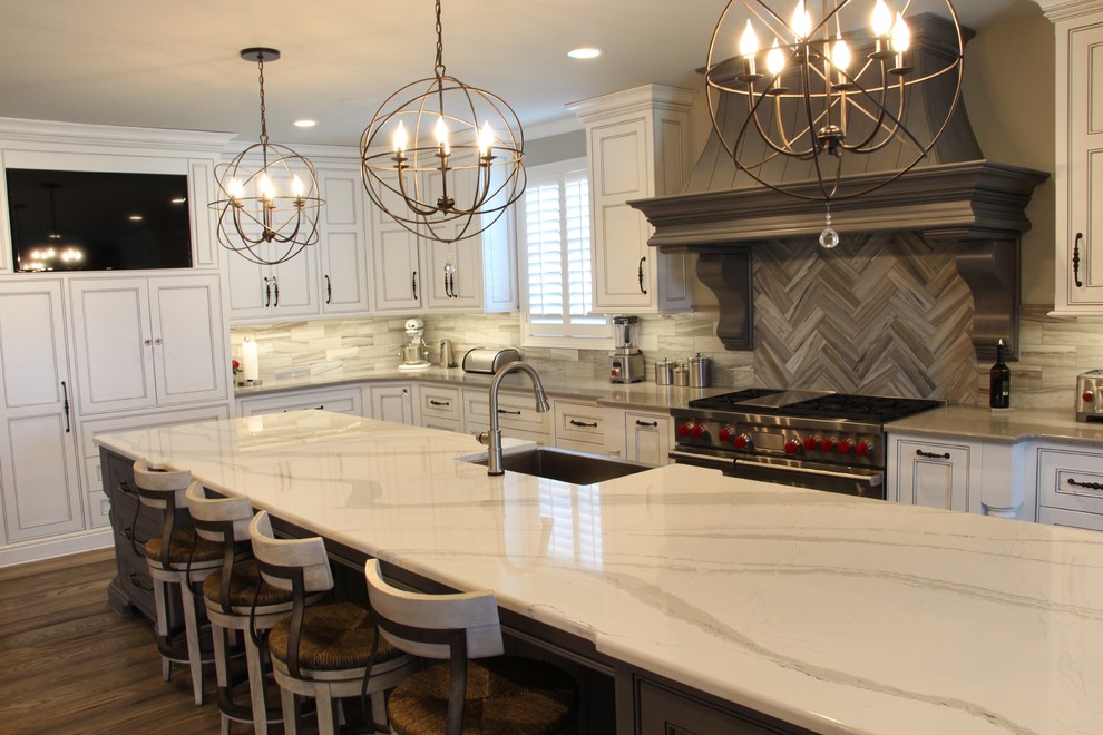 Inspiration for a large transitional medium tone wood floor and gray floor eat-in kitchen remodel in Other