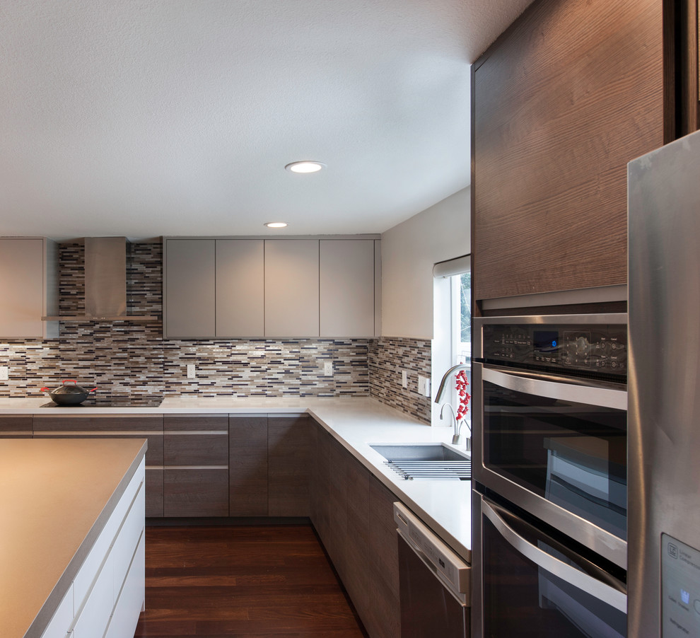 Inspiration for a mid-sized modern l-shaped medium tone wood floor open concept kitchen remodel in San Francisco with an undermount sink, flat-panel cabinets, light wood cabinets, quartz countertops, multicolored backsplash, matchstick tile backsplash, stainless steel appliances and an island