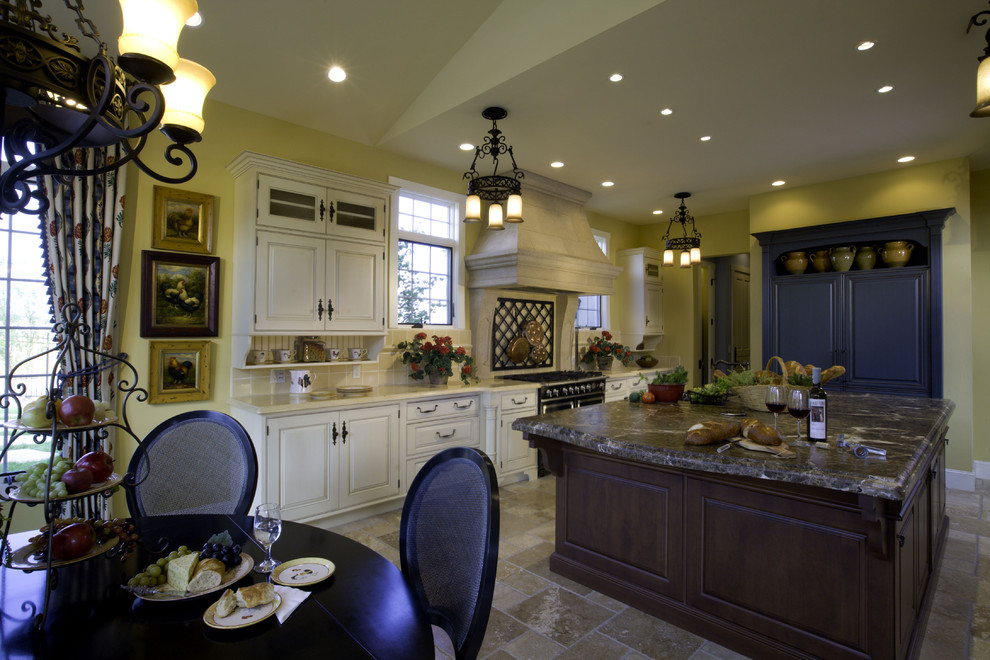 Example of a tuscan kitchen design in Denver with blue cabinets