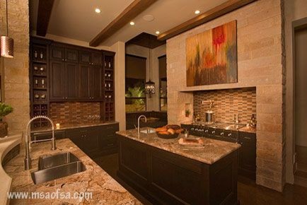 Inspiration for a contemporary u-shaped concrete floor kitchen remodel in Austin with an undermount sink, recessed-panel cabinets, dark wood cabinets, granite countertops, multicolored backsplash, glass tile backsplash and stainless steel appliances