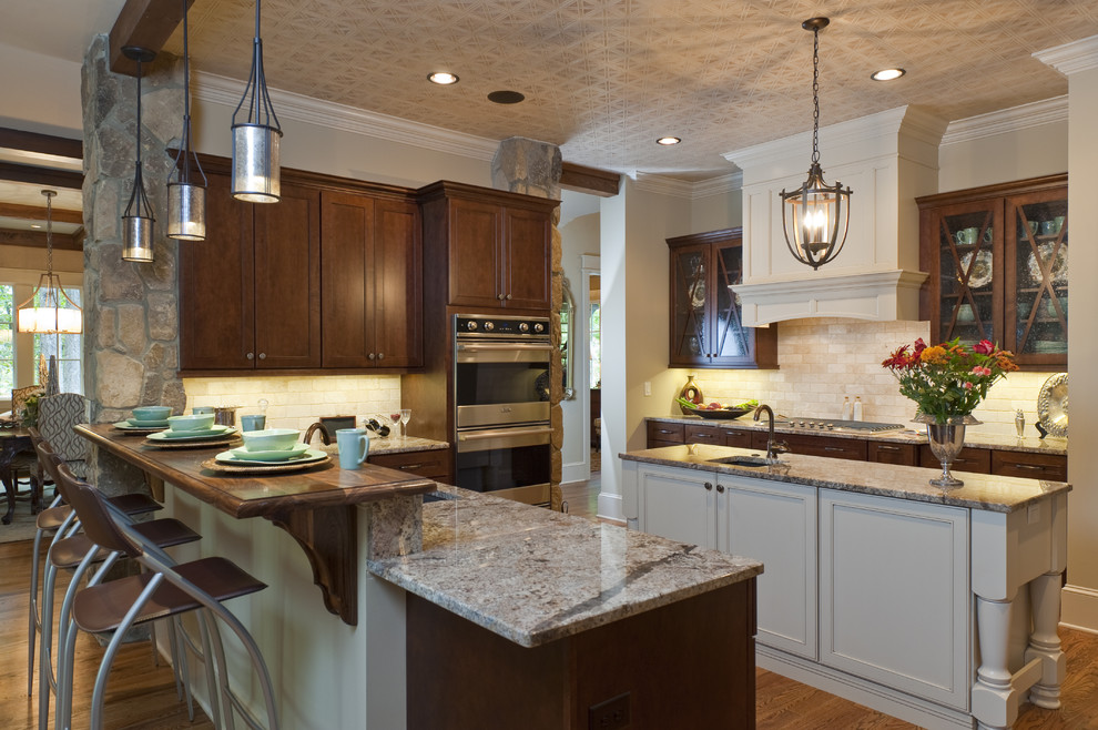Inspiration for a timeless kitchen remodel in Other with stainless steel appliances and granite countertops