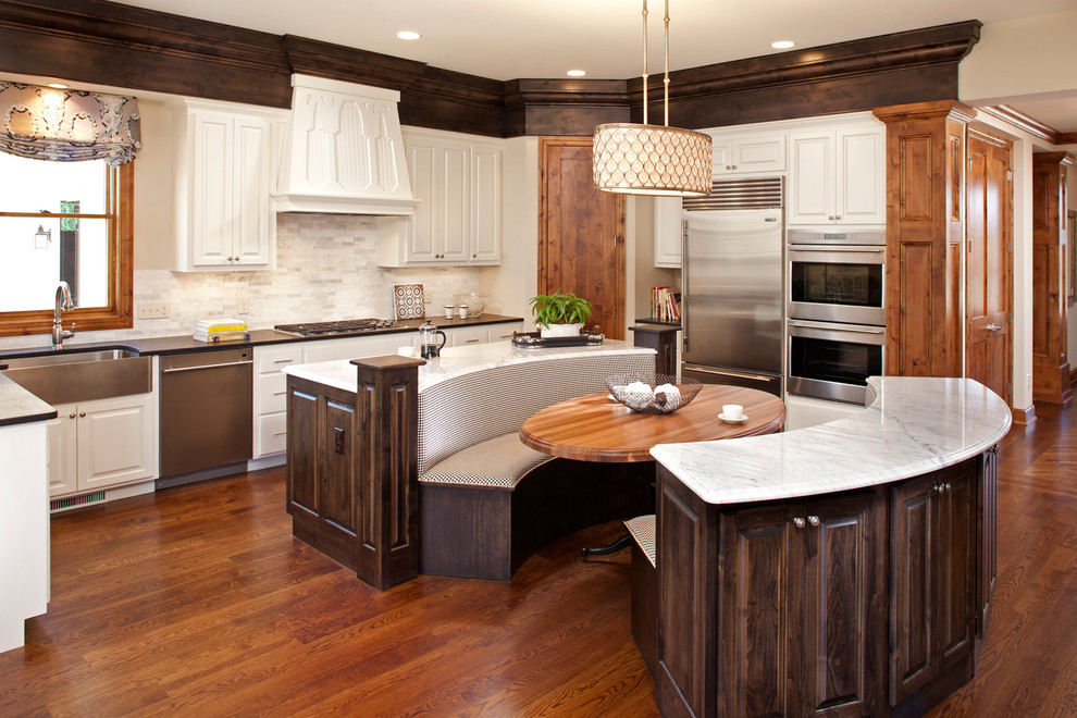 Elegant eat-in kitchen photo in Minneapolis with raised-panel cabinets and white cabinets