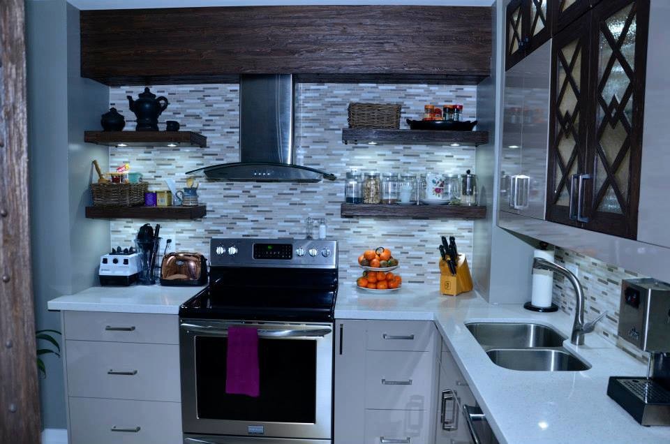 Photo of a small classic l-shaped enclosed kitchen in Toronto with a submerged sink, flat-panel cabinets, grey cabinets, quartz worktops, grey splashback, mosaic tiled splashback, stainless steel appliances, porcelain flooring and no island.