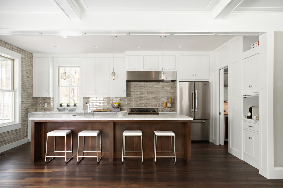 Kitchen - contemporary galley kitchen idea in Minneapolis with shaker cabinets, white cabinets, marble countertops, gray backsplash, subway tile backsplash and stainless steel appliances