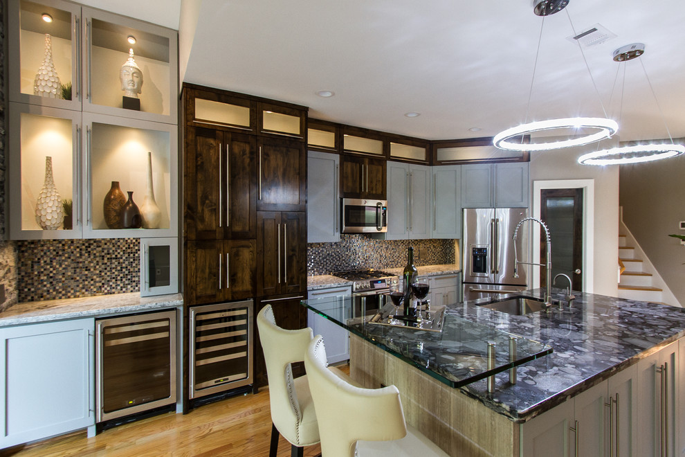 Mid-sized 1950s single-wall light wood floor open concept kitchen photo in Houston with shaker cabinets, dark wood cabinets, wood countertops, blue backsplash, mosaic tile backsplash, stainless steel appliances and an island
