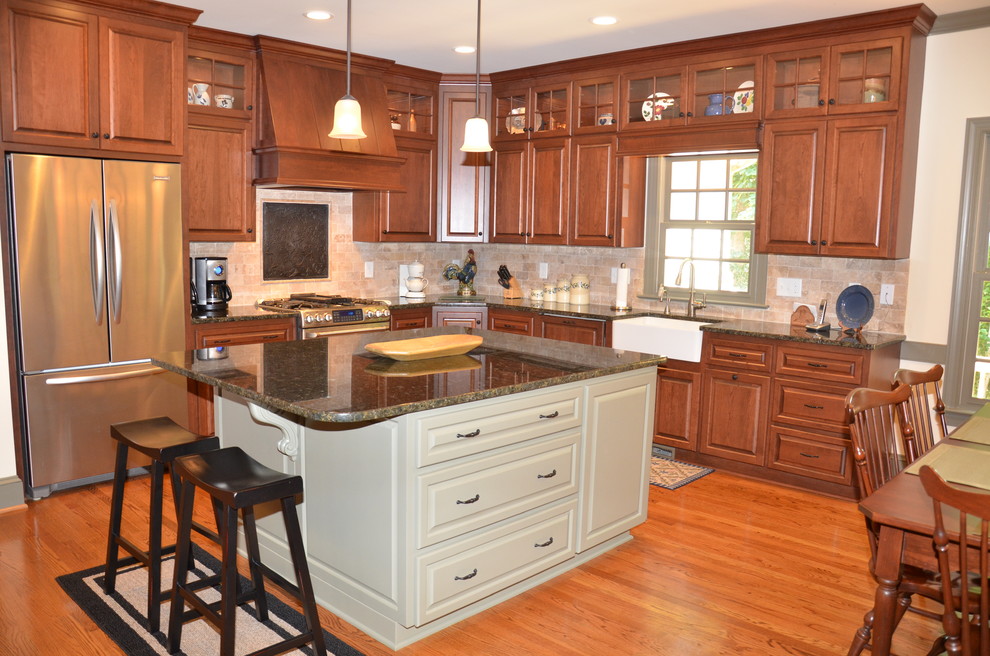 Example of a trendy medium tone wood floor kitchen design in Raleigh