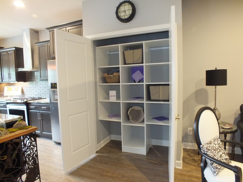 This is an example of a medium sized contemporary single-wall kitchen pantry in Cleveland with a submerged sink, shaker cabinets, grey cabinets, quartz worktops, grey splashback, metro tiled splashback, stainless steel appliances and an island.
