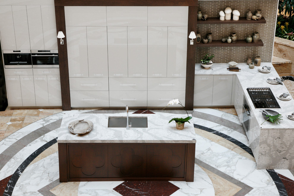 Inspiration for a modern kitchen remodel in Atlanta with quartz countertops and an island
