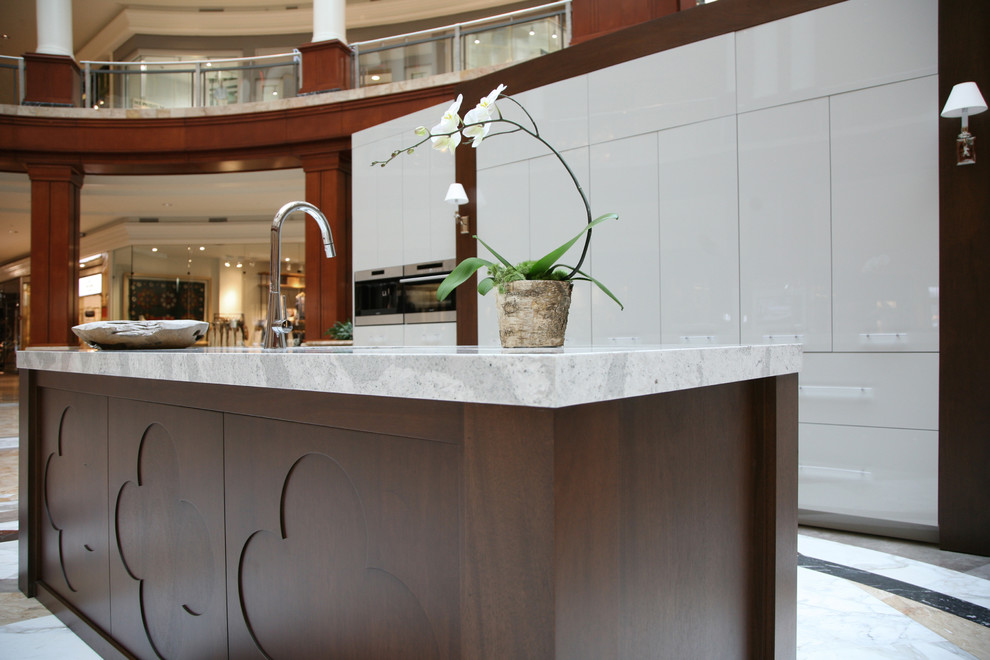 Kitchen - modern kitchen idea in Atlanta with quartz countertops and an island