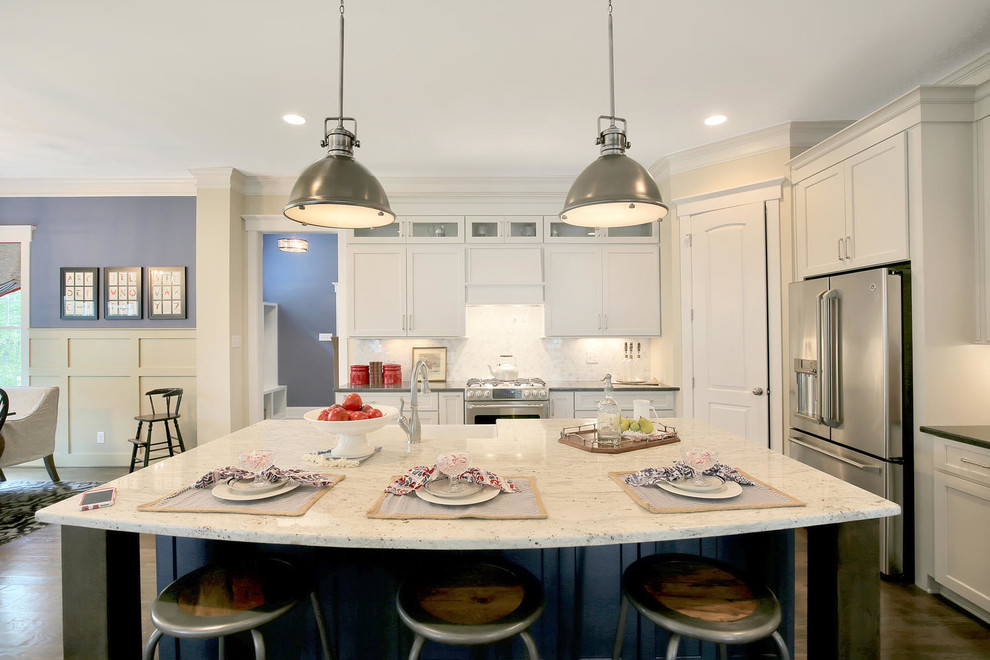 Eat-in kitchen - mid-sized transitional l-shaped dark wood floor and brown floor eat-in kitchen idea in Richmond with a farmhouse sink, shaker cabinets, white cabinets, granite countertops, white backsplash, marble backsplash, stainless steel appliances and an island