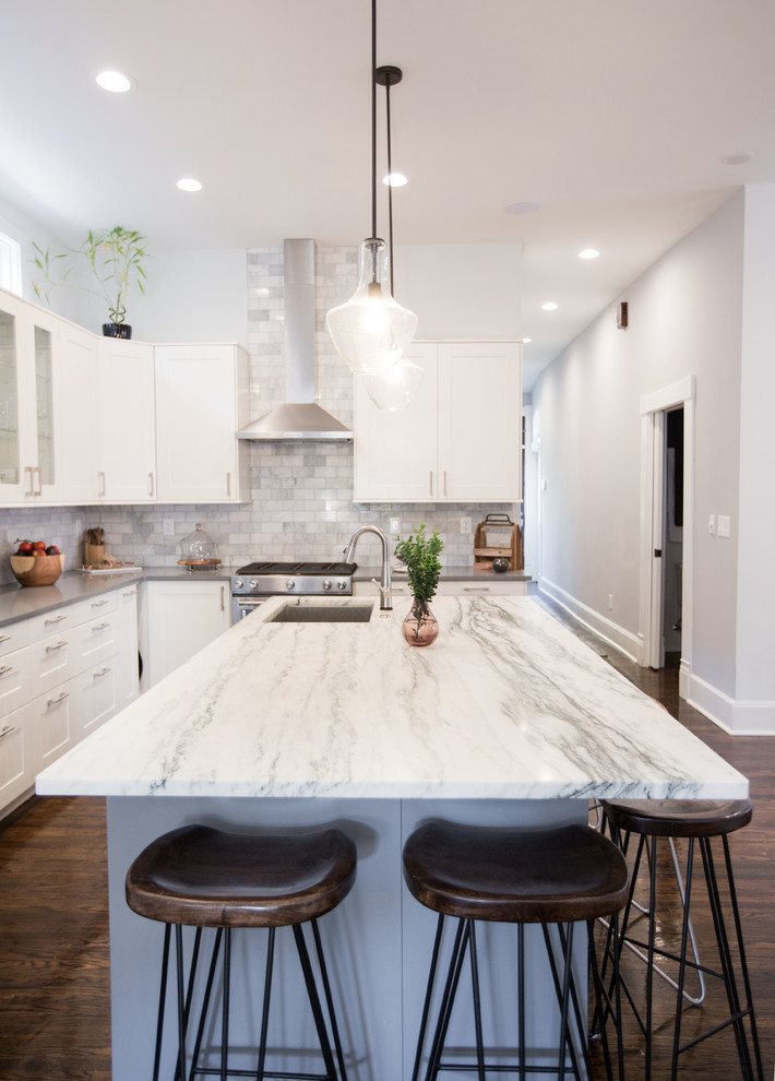 Example of a small trendy single-wall dark wood floor and brown floor open concept kitchen design in Indianapolis with an undermount sink, recessed-panel cabinets, white cabinets, quartz countertops, stainless steel appliances and gray countertops
