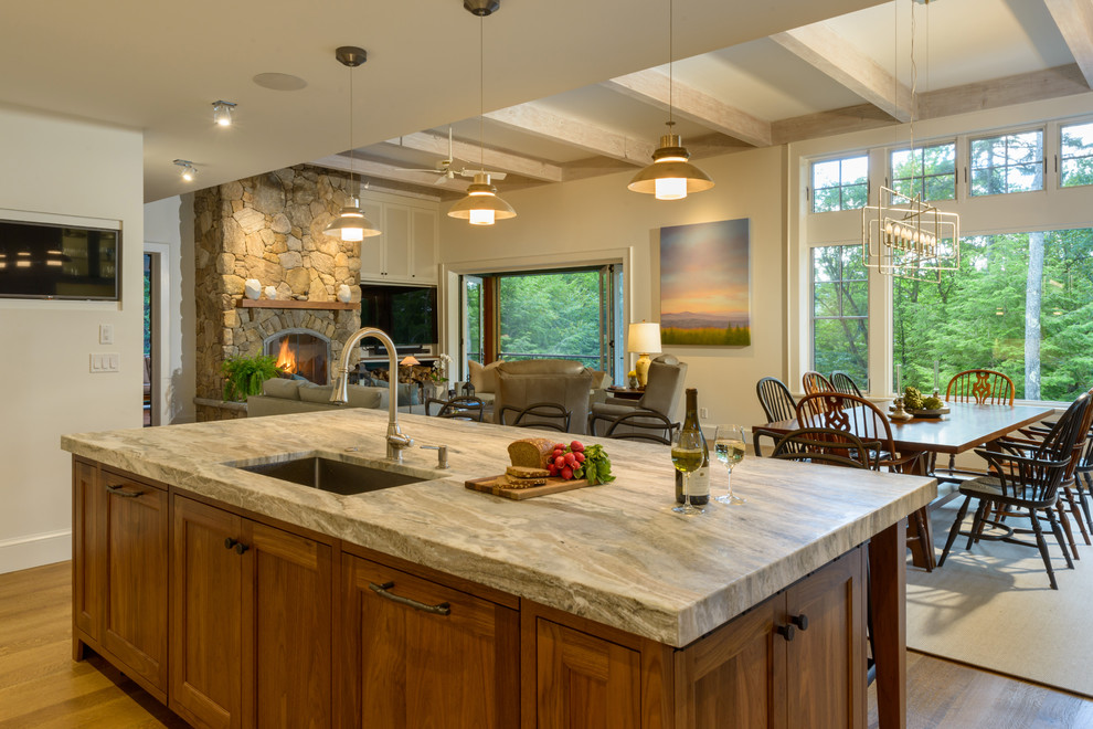 Large trendy l-shaped medium tone wood floor and brown floor open concept kitchen photo in Boston with an undermount sink, shaker cabinets, white cabinets, quartzite countertops, gray backsplash, ceramic backsplash, stainless steel appliances, an island and gray countertops