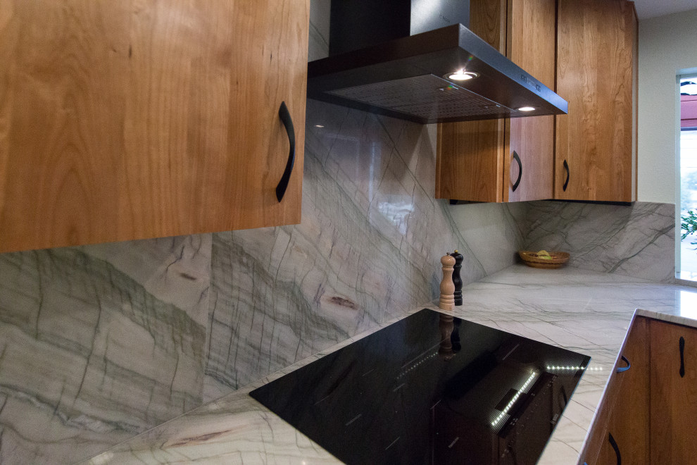 Example of a mid-sized trendy porcelain tile eat-in kitchen design in Denver with an undermount sink, flat-panel cabinets, light wood cabinets, quartzite countertops, stone slab backsplash, stainless steel appliances, no island and turquoise countertops