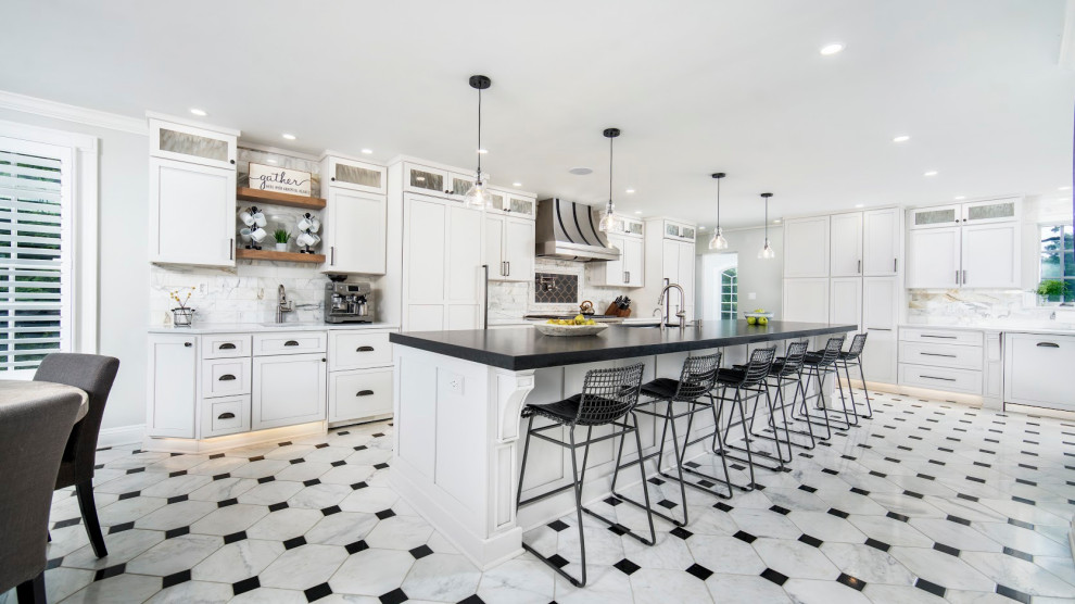 Inspiration for a huge l-shaped porcelain tile and white floor eat-in kitchen remodel in Other with an undermount sink, shaker cabinets, white cabinets, granite countertops, white backsplash, ceramic backsplash, stainless steel appliances, two islands and black countertops