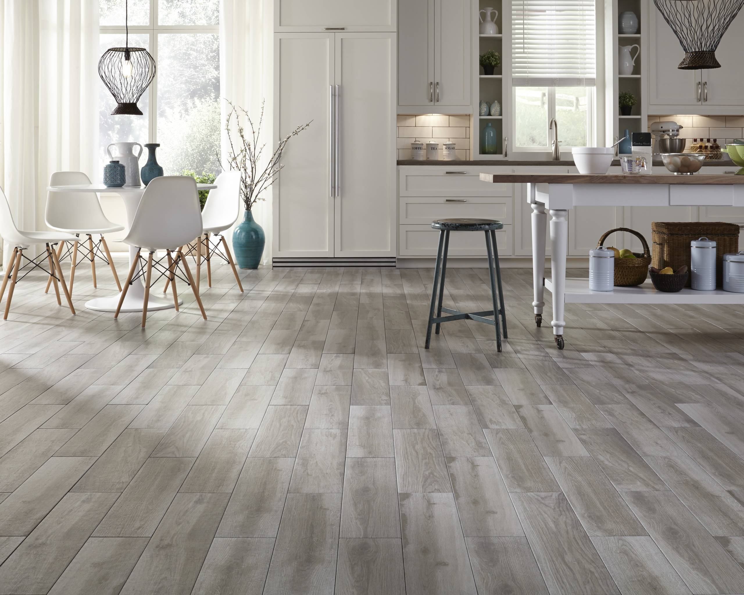 light hardwoord floor in kitchen with white cabinet