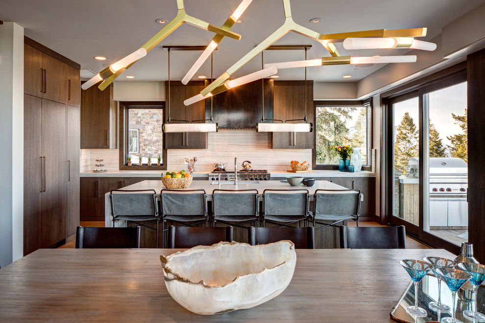 Photo of an expansive contemporary kitchen/diner in Salt Lake City with flat-panel cabinets, medium wood cabinets and an island.