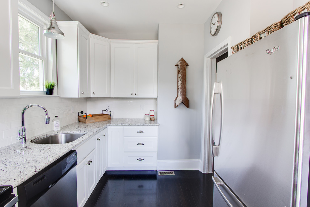 Design ideas for a small classic galley enclosed kitchen in Richmond with flat-panel cabinets, white cabinets, white splashback, metro tiled splashback, stainless steel appliances, dark hardwood flooring and no island.