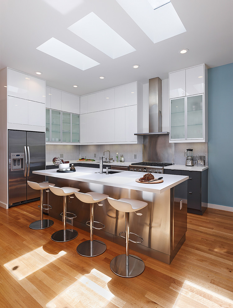 Contemporary l-shaped kitchen in San Francisco with flat-panel cabinets and stainless steel appliances.