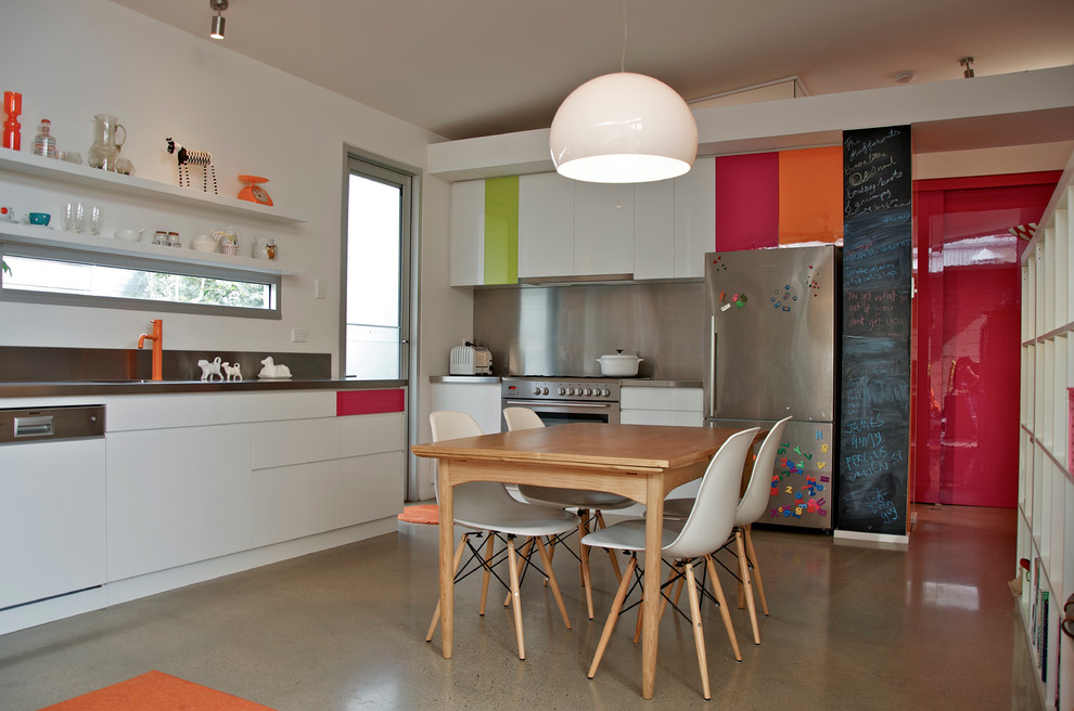 Example of an eclectic kitchen design in Adelaide with stainless steel appliances and stainless steel countertops