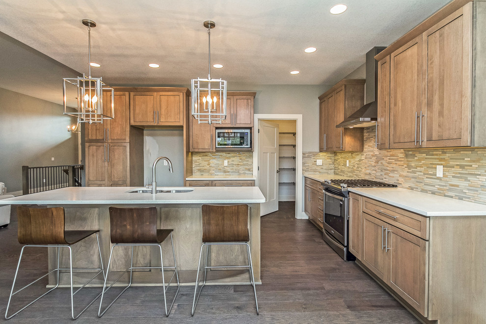 Eat-in kitchen - large craftsman l-shaped medium tone wood floor eat-in kitchen idea in Other with an undermount sink, shaker cabinets, distressed cabinets, quartz countertops, multicolored backsplash, stone tile backsplash, stainless steel appliances and an island