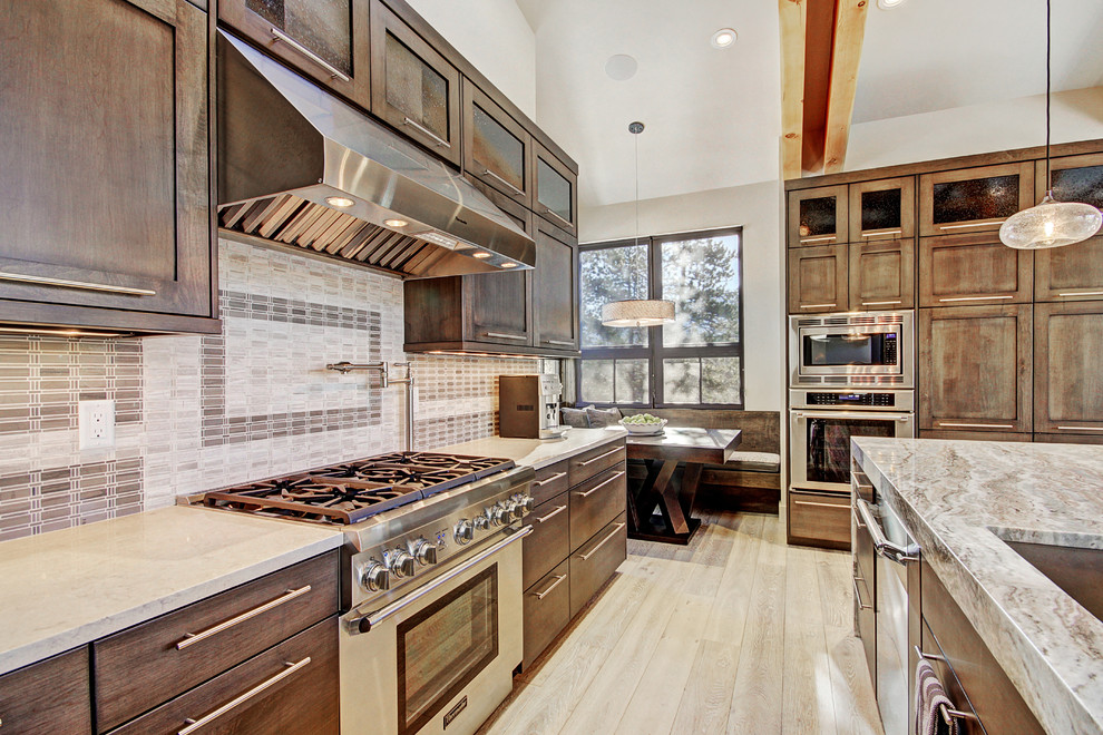 Example of a transitional kitchen design in Denver