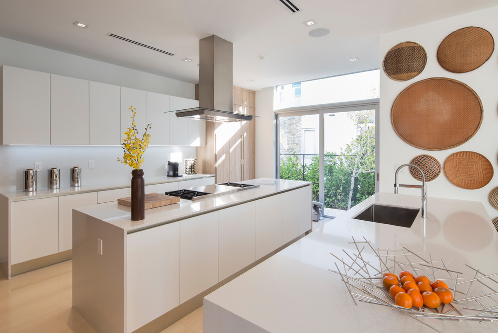 Inspiration for a medium sized contemporary kitchen in Miami with a built-in sink, flat-panel cabinets, white cabinets, wood worktops, white splashback, integrated appliances, porcelain flooring, multiple islands, beige floors and beige worktops.