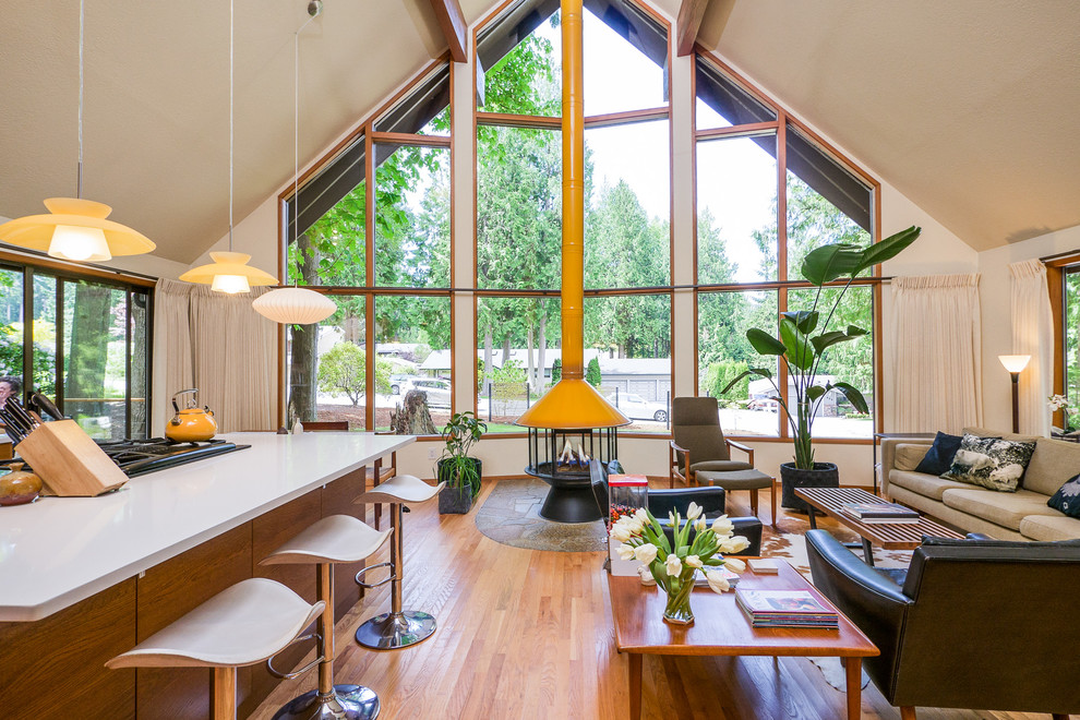 Источник вдохновения для домашнего уюта: кухня-гостиная в стиле модернизм с плоскими фасадами и фасадами цвета дерева среднего тона