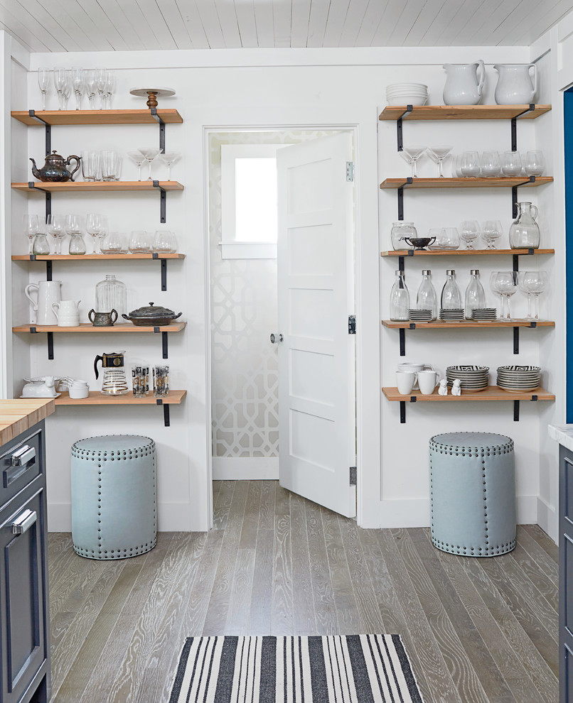 Kitchen - mid-sized coastal medium tone wood floor kitchen idea in Miami with a double-bowl sink, recessed-panel cabinets, blue cabinets, wood countertops, stainless steel appliances and an island