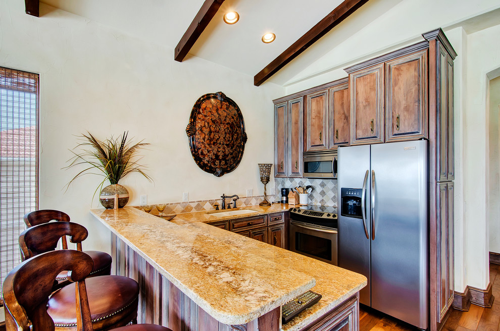 Example of a tuscan kitchen design in Miami