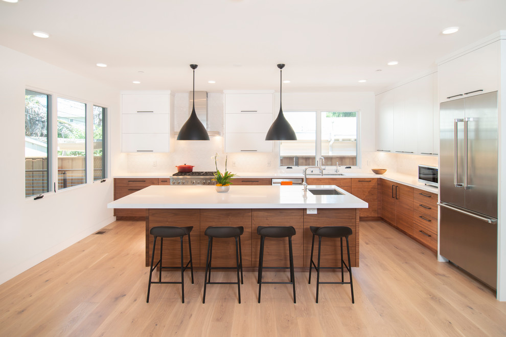 Design ideas for a contemporary l-shaped kitchen in San Francisco with flat-panel cabinets and medium wood cabinets.