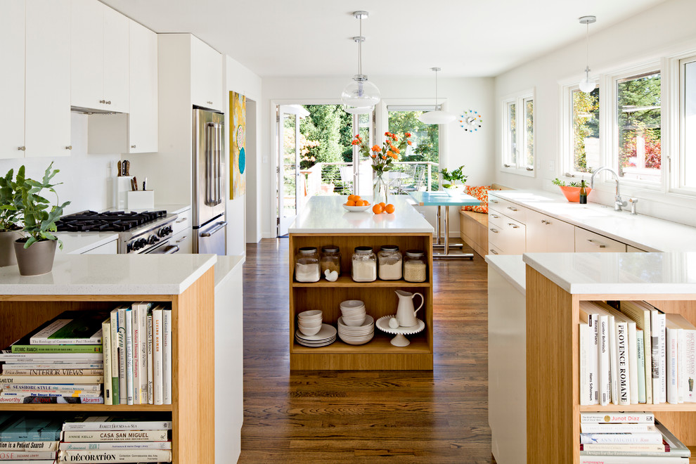 Contemporary kitchen in Portland with flat-panel cabinets and white cabinets.