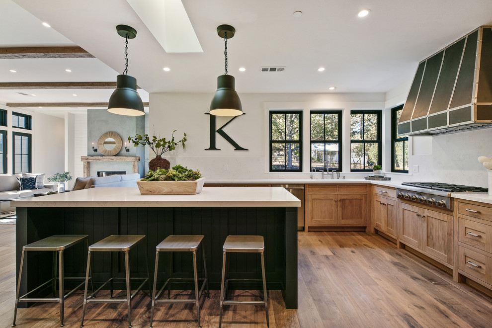 Transitional u-shaped kitchen photo in San Francisco with shaker cabinets and light wood cabinets
