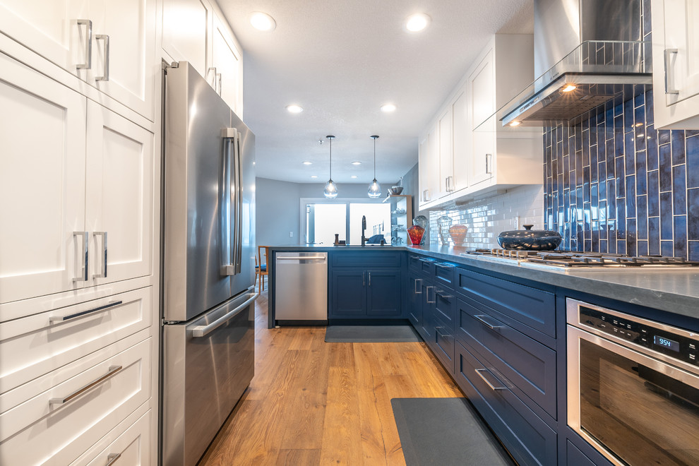 Inspiration for a classic galley kitchen in San Francisco with beaded cabinets and blue cabinets.