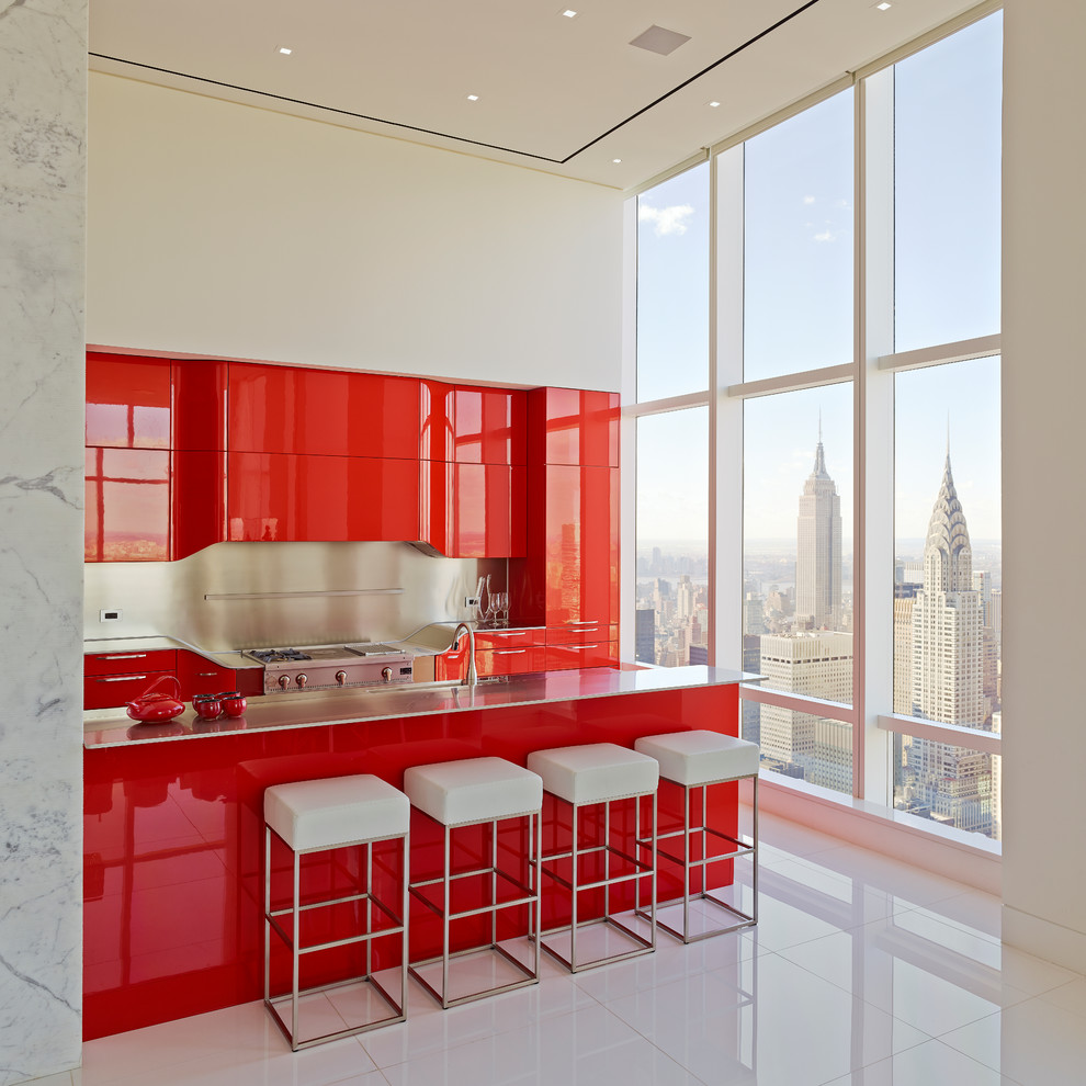 Kitchen - contemporary l-shaped kitchen idea in New York with flat-panel cabinets, red cabinets, stainless steel appliances and an island