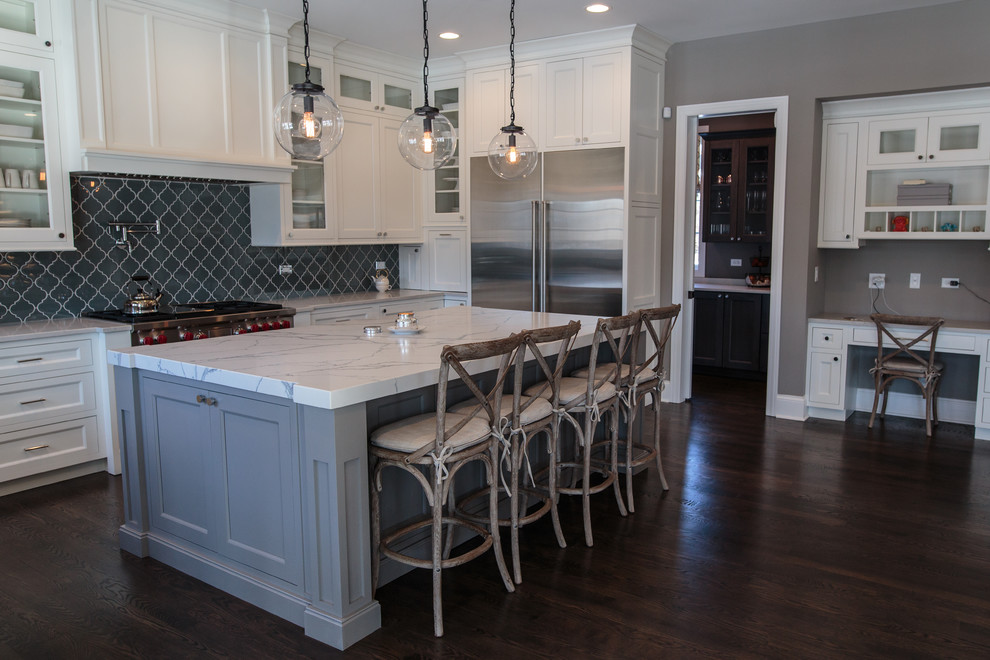 Example of a large transitional u-shaped dark wood floor eat-in kitchen design in Chicago with an undermount sink, shaker cabinets, white cabinets, marble countertops, blue backsplash, glass tile backsplash, stainless steel appliances and an island