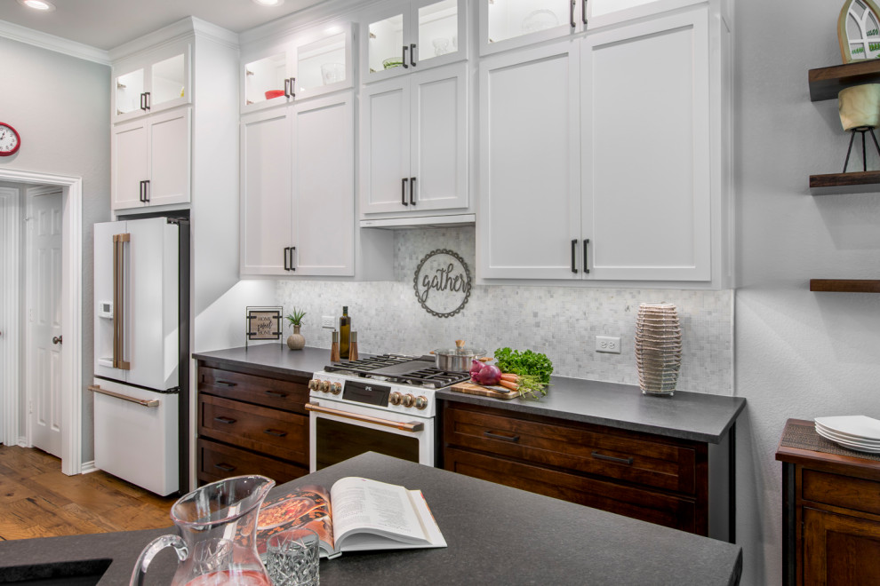 Example of a mid-sized transitional galley medium tone wood floor and brown floor eat-in kitchen design in Other with an undermount sink, shaker cabinets, brown cabinets, granite countertops, white backsplash, mosaic tile backsplash, white appliances, no island and black countertops